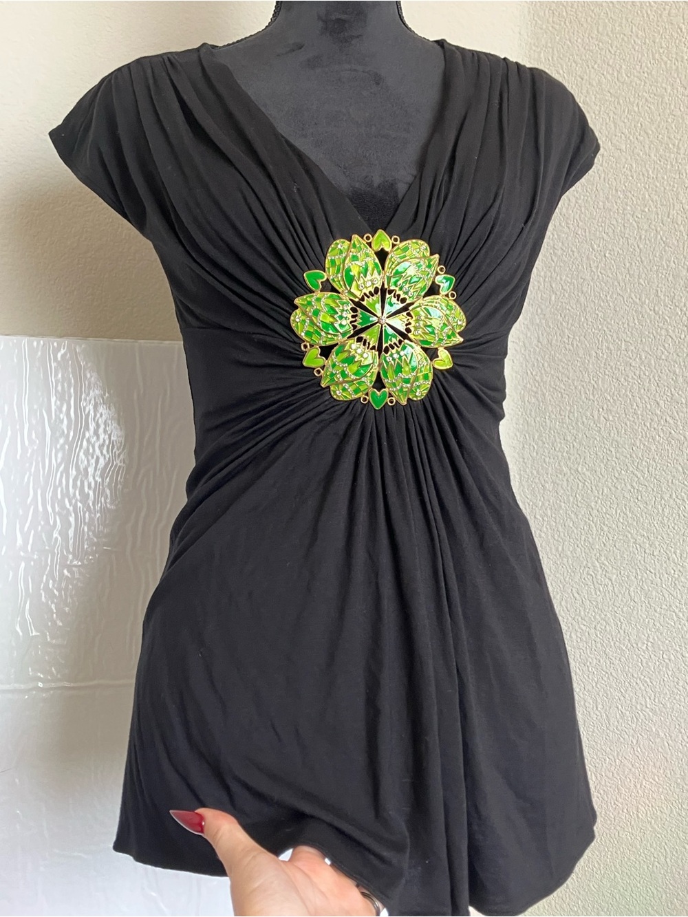 Black Women's V-Neck Top with Green Floral Accent